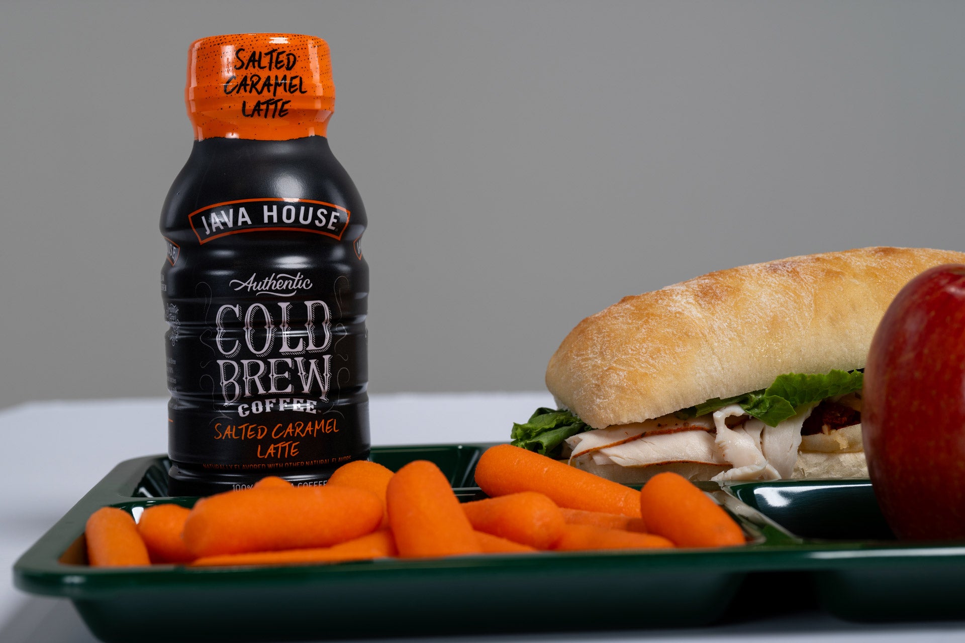 Java House Cold Brew Coffee with school lunch plate
