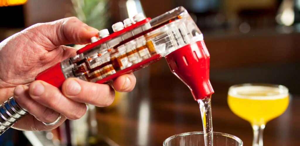 Person using a soda fountain