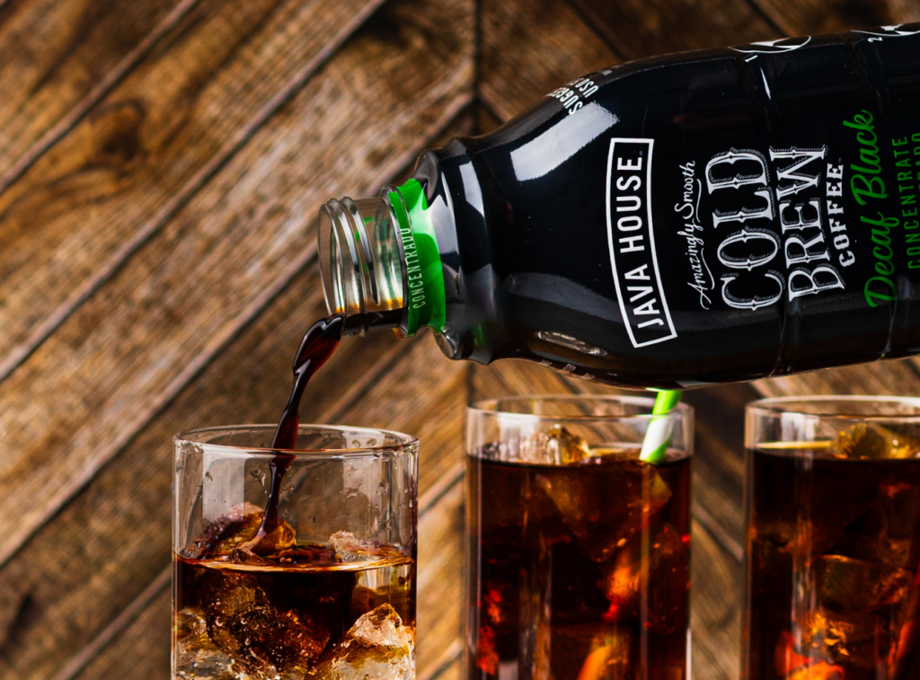 Pouring a glass of Java House ready to drink cold brew